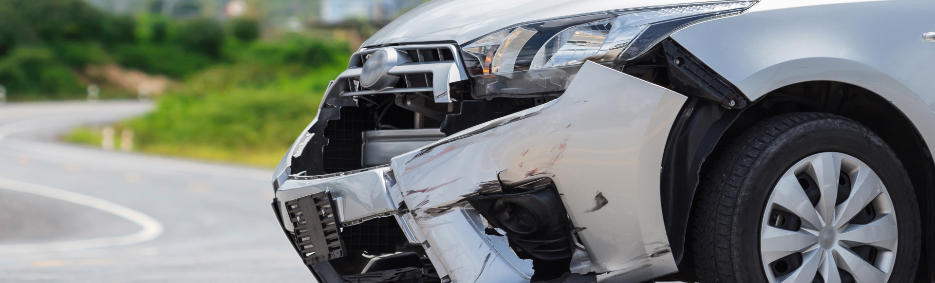 Silver car get damaged by crash accident on the road Car repair or car insurance concept