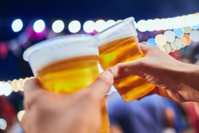an images of hands cheering with a plastic cup of light beer. Before you drink in TN though , you may want ask, 
